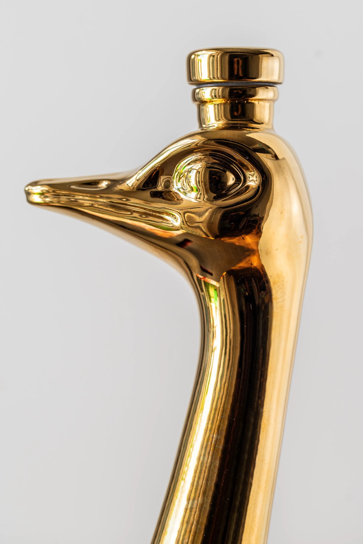 Ostrich head bottle stopper shown in profile
