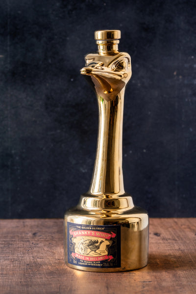 Shanky's Whip Gold bottle with the ostrich head stopper fitted