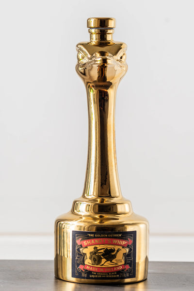 Shanky's Whip Gold bottle and ostrich head stopper, second angled view