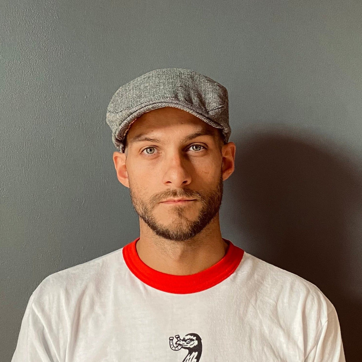 Shanky's Whip tweed flat cap seen from the front with the peak forward