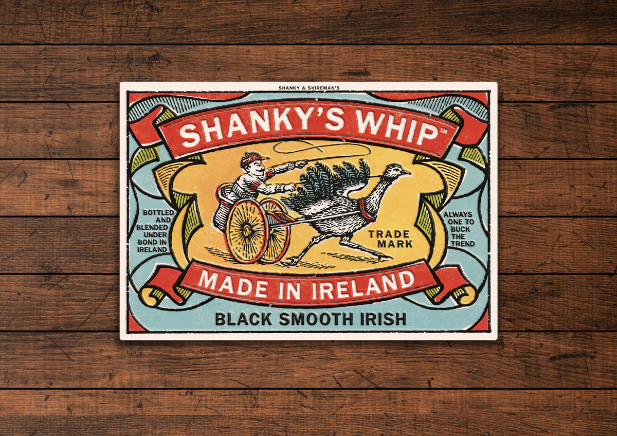 Shanky's Whip tin sign mounted on a dark wood panel